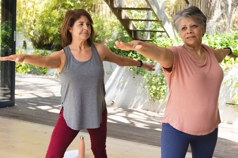 Senior Women Practicing Yoga Outdoors in Natural Serenity