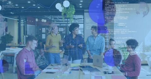 Diverse Team Collaborating at Open-Plan Tech Workspace with Code and Data Overlay