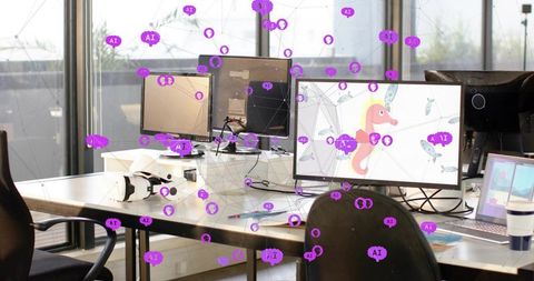 Modern tech workspace showing triple monitors with seahorse illustration and vr headset