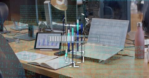 Wooden desk workstation in open office featuring analytics hud overlay and dashboards