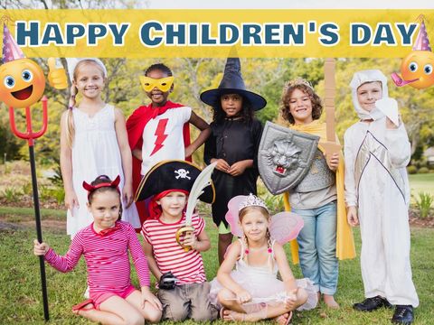 Diverse group of children in costumes celebrating children's day outdoors