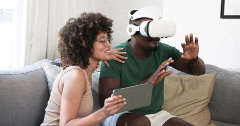 Couple Experiencing Virtual Reality Innovation at Home