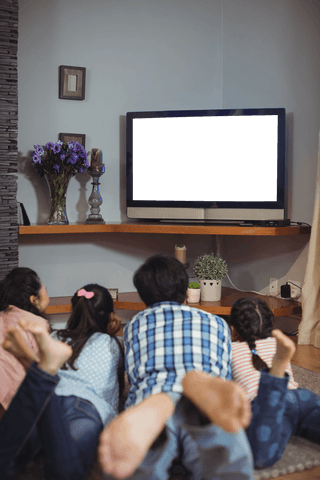 Transparent screen concept with family watching tv at home