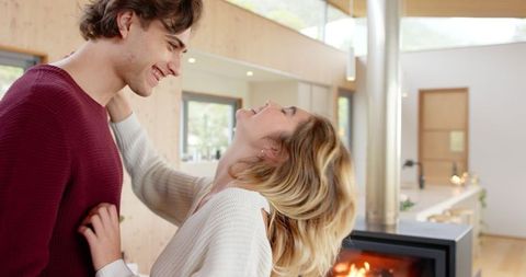 Loving Couple Smiling in Modern Cozy Living Room