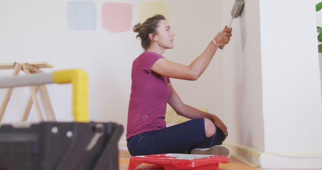 Young Woman Painting Wall in Renovation Project - Download Free Stock Images Pikwizard.com