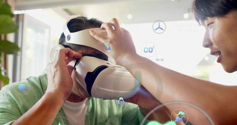 Instructor adjusting vr headset on older adult for interactive augmented reality demo