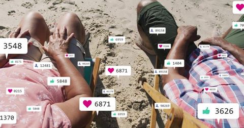 Senior Couple Relaxing on Beach Surrounded by Social Media Icons