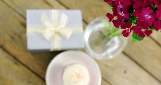 Gift with Flower Bouquet and Cupcake on Wooden Table - Download Free Stock Images Pikwizard.com