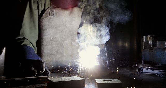 Welder Working in Industrial Environment with Bright Spark in Dark Room - Download Free Stock Images Pikwizard.com