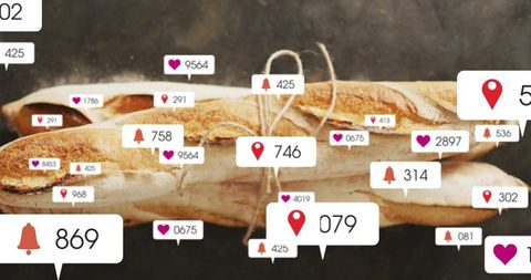 Rustic baguettes tied with twine receiving social media likes, location pins and alerts