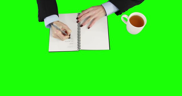 Business Person Writing in Notebook with Coffee - Download Free Stock Images Pikwizard.com