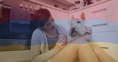 Woman Enjoying Coffee with Terrier Dog in Cozy Kitchen