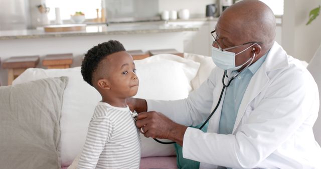 African American Doctor Examining Young Child with Stethoscope at Home - Download Free Stock Images Pikwizard.com