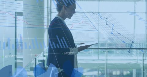 Businesswoman Analyzing Digital Data on Tablet Displays Charts