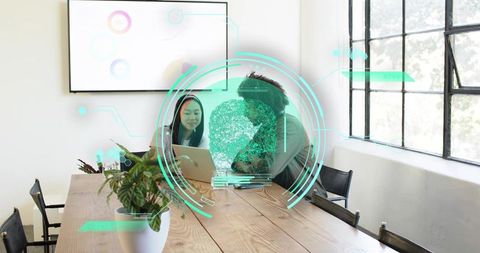Collaborating team exploring augmented reality brain hologram using laptop in modern office
