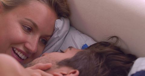 Romantic Couple Embracing and Connecting in Cozy Bedroom Scene