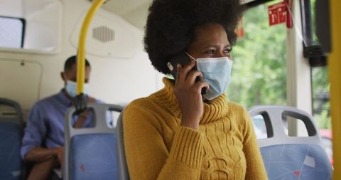 Businesswoman Talking on Smartphone while Commuting on Bus - Download Free Stock Images Pikwizard.com