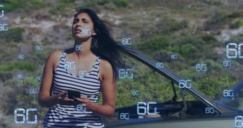Woman Engaging with Futuristic 6G Network Technology Outdoors