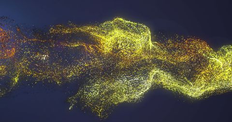 Swirling Yellow Particles on Dark Background Creating Vibrant Energy