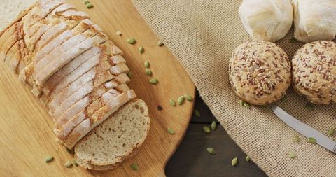 Assorted Fresh Bread Loaves and Rolls on Table - Download Free Stock Images Pikwizard.com