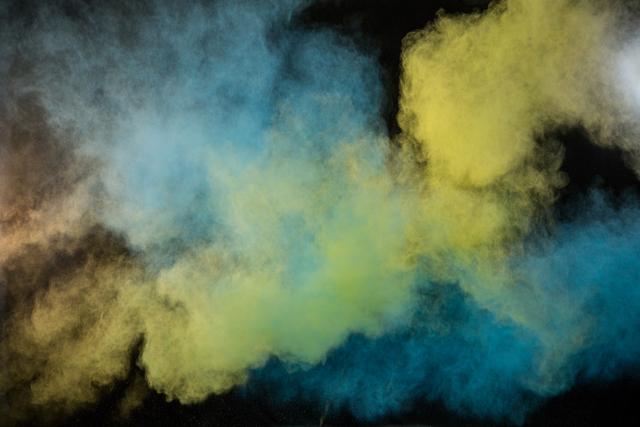 Color powder explosion creates a dynamic and vibrant cloud against a black background. Perfect for use in artistic projects, event promotions, festival designs, and advertisements needing a burst of color and energy. Ideal for backgrounds and headers in creative websites or social media posts.