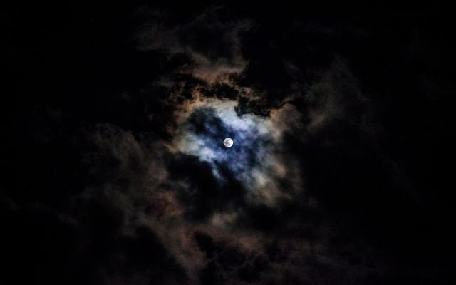 Mysterious Full Moon Surrounded By Dark Clouds At Night - Download Free Stock Photos Pikwizard.com