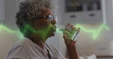 Senior Woman Drinking Water with Vibrant Health Concept