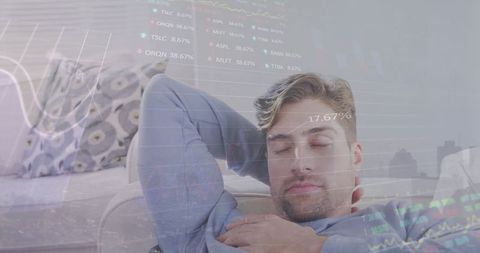 Caucasian Man Sleeping with Projected Financial Data Dashboard