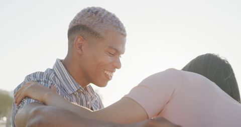 Happy Diverse Couple Laughing on Sunny Beach - Download Free Stock Images Pikwizard.com