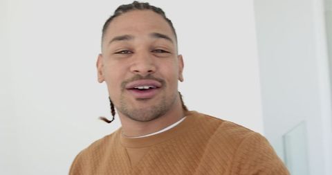 Confident african american man communicating in modern space