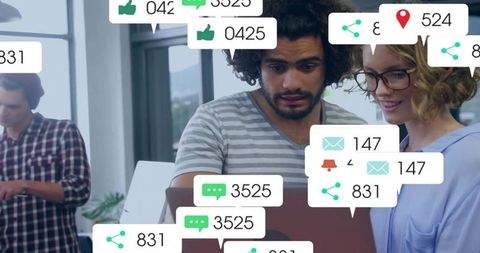 Colleagues Interacting with Digital Notifications in Modern Workspace
