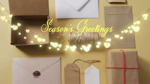 Festive Greetings with Decorative String Lights on Gift Boxes