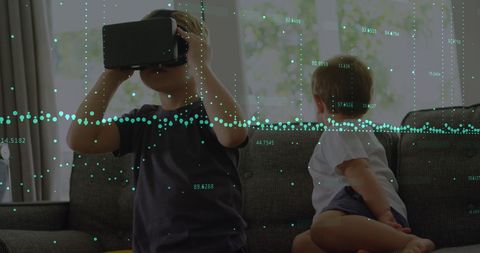 Child Engaged in VR Technology Amidst Data Visualization
