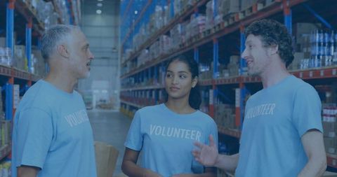 Volunteers collaborating on distribution in warehouse