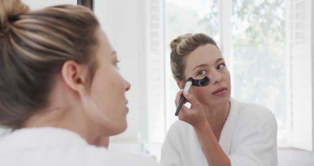 Woman Applying Skincare Mask in Bathroom Mirror - Download Free Stock Images Pikwizard.com