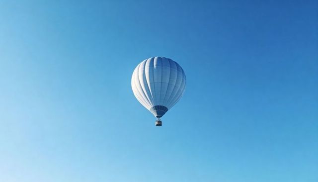 Pastel Blue Hot Air Balloon Floating Over Clear Sky Minimalist Aerial Travel Concept