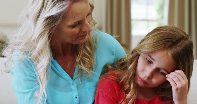 Concerned mother comforting sad daughter at home - Download Free Stock Images Pikwizard.com