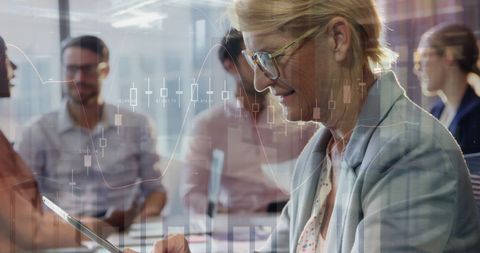 Businesswoman Analyzing Financial Data at Collaborative Office