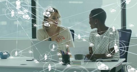 Colleagues Collaborating in Office with Digital Network Overlay