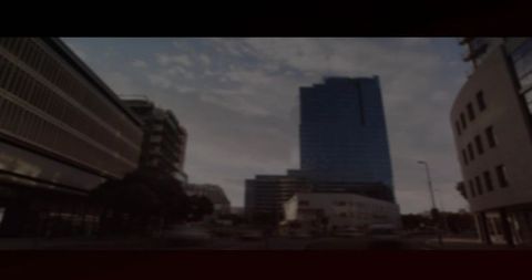 Urban Cityscape with Modern Glass High-Rise at Dusk