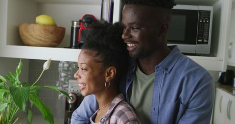 Joyful African American Couple Embracing in Cozy Kitchen - Download Free Stock Images Pikwizard.com