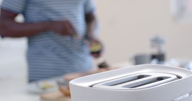 Preparing Breakfast with Modern Toaster in Focus - Download Free Stock Images Pikwizard.com