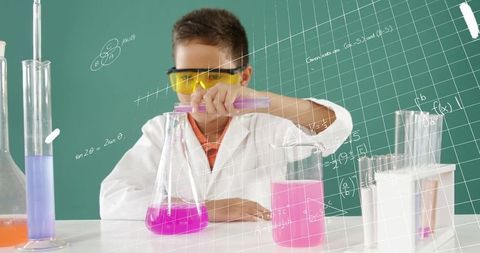 young scientist conducting chemistry experiment in classroom - Download Free Stock Images Pikwizard.com
