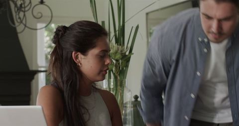 Couple sharing coffee and engaging in lighthearted conversation