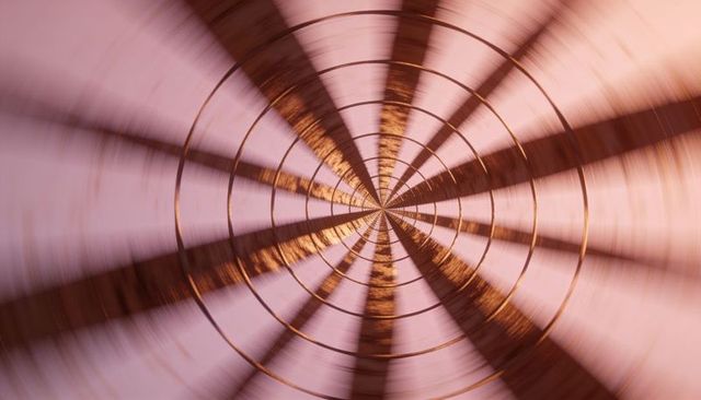 Spinning concentric metallic ring tunnel with copper reflection and radial motion blur