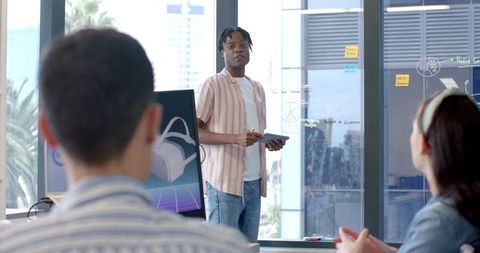 Team Collaborating on Virtual Reality Project in Modern Office