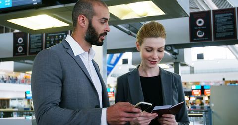 Business Professionals Collaborating at Airport Terminal