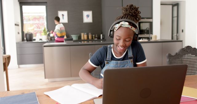 Teenager Studying at Home with Headphones and Laptop - Download Free Stock Images Pikwizard.com