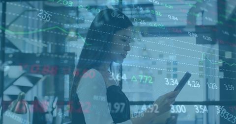 Asian Businesswoman Analyzing Financial Data on Tablet with Virtual Interface - Download Free Stock Images Pikwizard.com