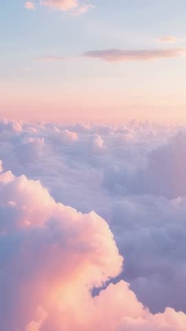Glowing clouds drifting at dawn, camera tilting upward revealing pastel sky